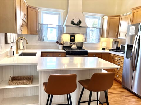 Newly installed quartz countertops and 
new gas cooktop and oven