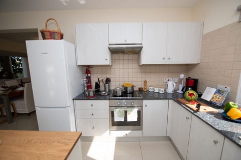 Kitchen complete with oven, fridge, microwave, dishwasher and coffee machine