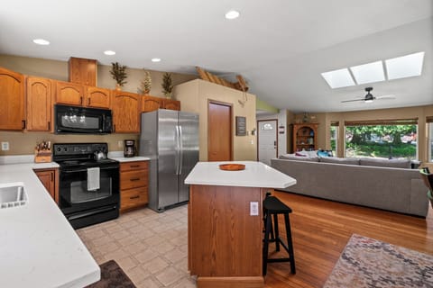 Open-concept living with kitchen flowing seamlessly into the family room.