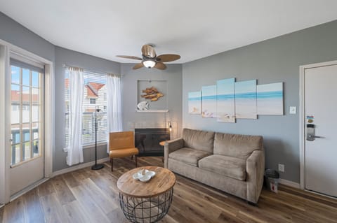 Unwind in your coastal haven with ocean-themed decor, comfy seating, and a fully equipped kitchen perfect for memorable meals together.
