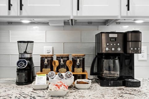 Coffee bar with 3 different beans, grinder, k-cup, teas, creamer, and sweeteners!