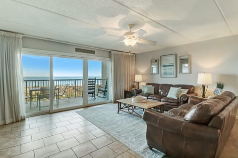331 Amelia By The Sea- Beautiful Living Space with Magnificent Ocean and Pool Views, a Large Flat Screen Smart TV, and a Slider to the Terrace