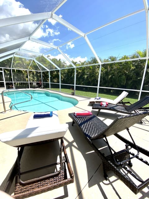Enjoy the sunshine on the 4 loungers by the pool.