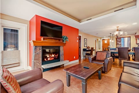 Unwind in the spacious living room with a cozy electric fireplace and cable TV.