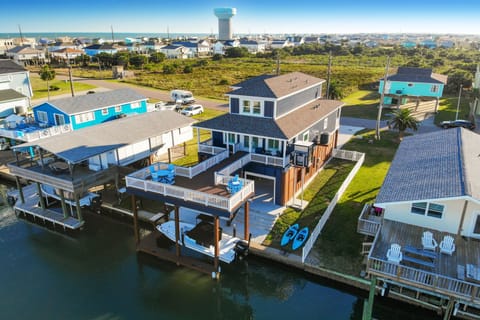 Aerial view showing the proximity to the beach and sprawling deck.