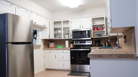 Stocked with utensils and dishware for your convenience! 