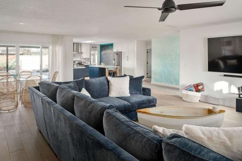 Living room is opened up to the dining room and the kitchen. The perfect inviting open floor plan.