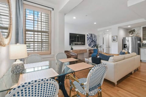 Spacious Living Room, featuring a separate Dining Area. Complete with AC, Smart TV, and comfy seating.