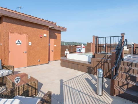 Rooftop view with full sized accessible hot tub and Restroom.