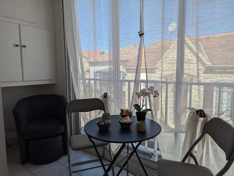 Spacious and bright loggia, offering a beautiful view of the street leading to the sea. Enjoy a pleasant and comfortable dining area