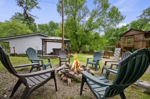 Sit back around the fire pit + relax in the hot tub, while the kiddos play.