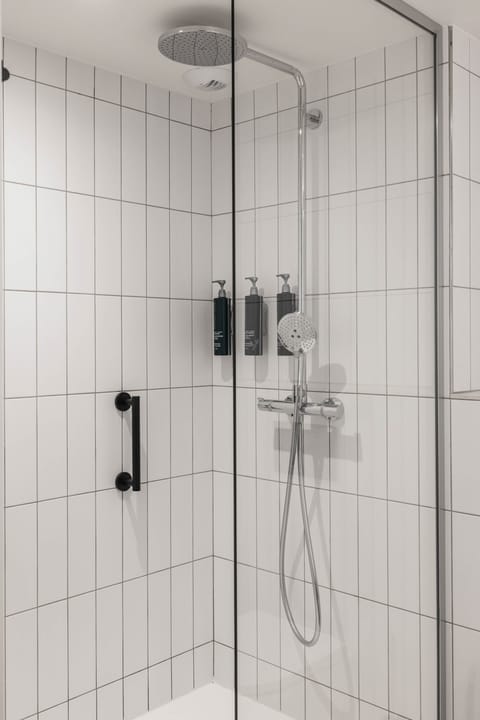 Deluxe Room, 1 King Bed with Sofa bed | Bathroom | Combined shower/tub, hair dryer, slippers, towels