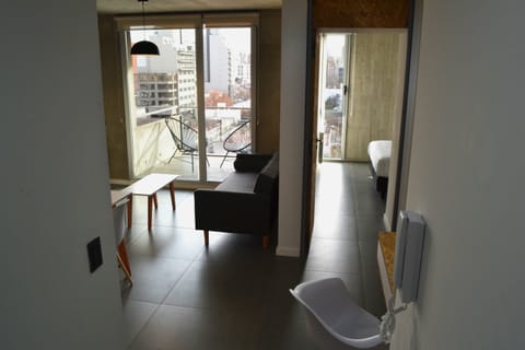 Deluxe Apartment, 1 Bedroom | Living area | 32-inch Smart TV with cable channels, TV, Netflix
