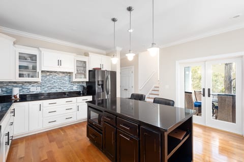 Doors lead to screened porch