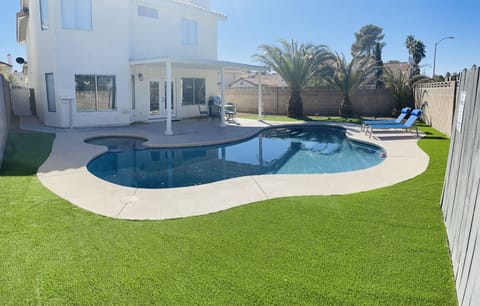 Clean, cozy home with sparkling pool minutes from the strip!  