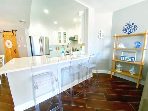 Counter Space w/ Barstools and Kitchen View From Living Room