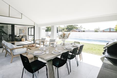 Alfresco living overlooking the pool and canal