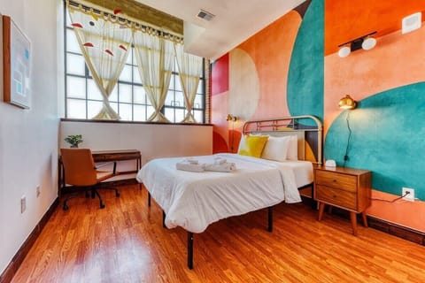 Artistic and bright bedroom with queen size bed