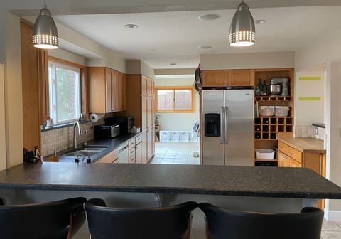 Fully stocked kitchen with spices and staples.