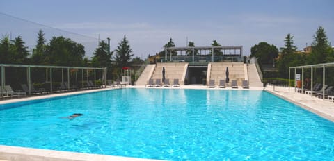 Seasonal outdoor pool, open 9:00 AM to 7:00 PM, pool umbrellas