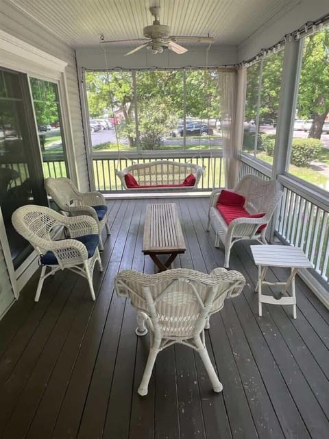 Gather Around and Enjoy a Good Read on A Harbor View`s Screened-in Porch