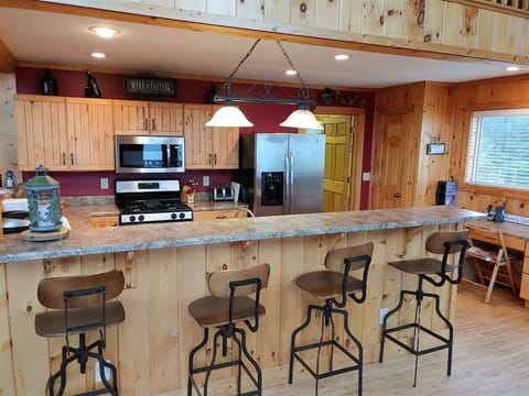 The kitchen has all the appliances, utensils, dishes and glassware you need.