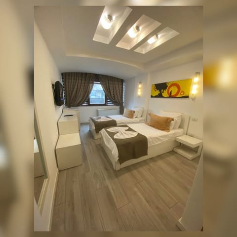 Premium bedding, desk, laptop workspace, blackout drapes