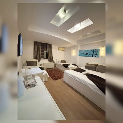 Comfort Quadruple Room | Premium bedding, desk, laptop workspace, blackout drapes