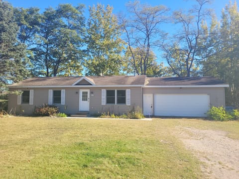 OVERVIEW:  The front of the home in late summer.