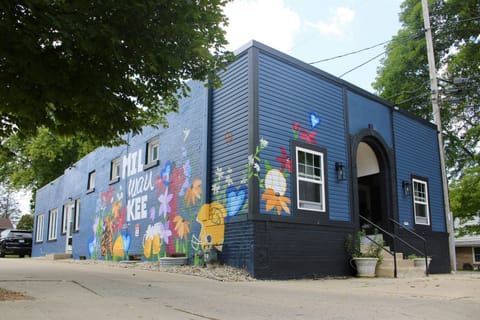 Welcome to the Bluemound Arcade! Fully equipped with arcade, foosball, and more Exterior: Vibrant mural and welcoming entrance await your Milwaukee adventure! 