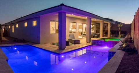 Stunning, private pool with a spacious hot tub that glows beautifully at night!