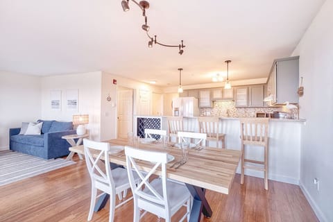 Dining table seats four with three extra spots at the bar