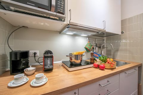 Family Apartment, Multiple Bedrooms (Il Nido Nella Pineta) | Private kitchenette | Fridge, microwave, stovetop, coffee/tea maker