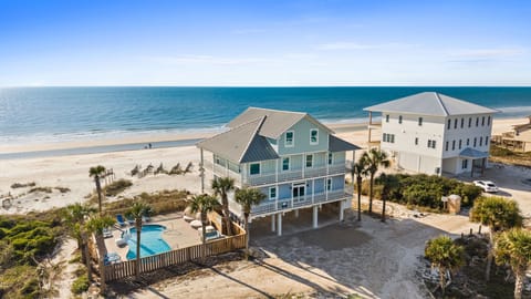 Stunning beachfront vacation rental with private pool and direct beach access in a pristine coastal setting.