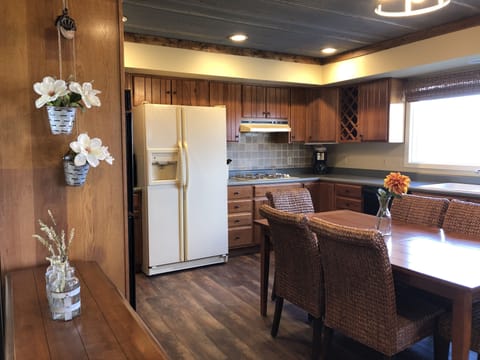 Large, fully equipped kitchen with seating for six people