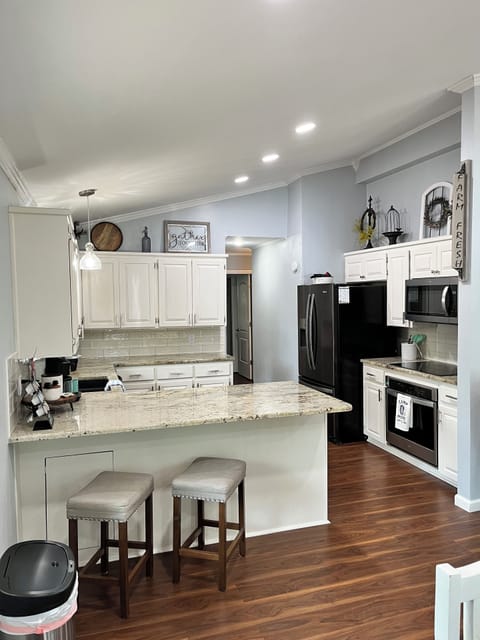 Granite countertops, new oven, new electric cooktop stove and a new microwave. 