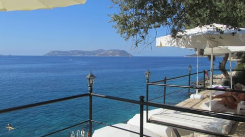 Private beach, white sand, sun loungers, beach umbrellas
