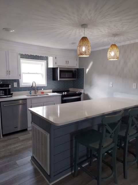 Kitchen with additional bar seating for 3