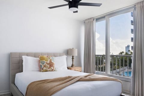 Queen bed and AC in this loft style studio apartment