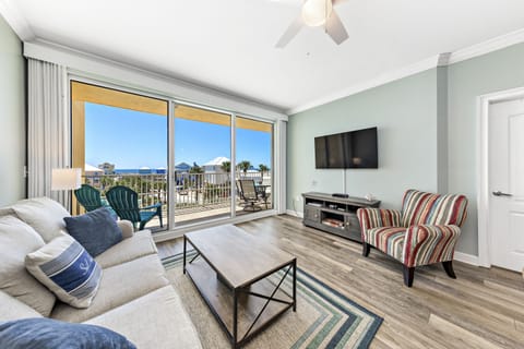 Living room. Step out to balcony overlooking pool and ocean.