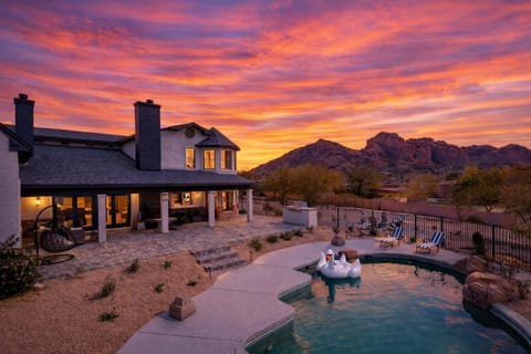 Stunning views of Camelback. Entertainer's yard - Rock pool with slide, bbq, putting green, fire place, fire pit and multiple lounge areas.