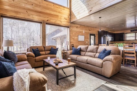 【Living room】 Enjoy all the comforts of home in this welcoming living room. With a plush sofa, cozy chair, and soft rug, you'll never want to leave.
