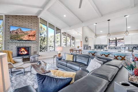 Leather Sectional with Adjustable Headrest and Gas Fireplace