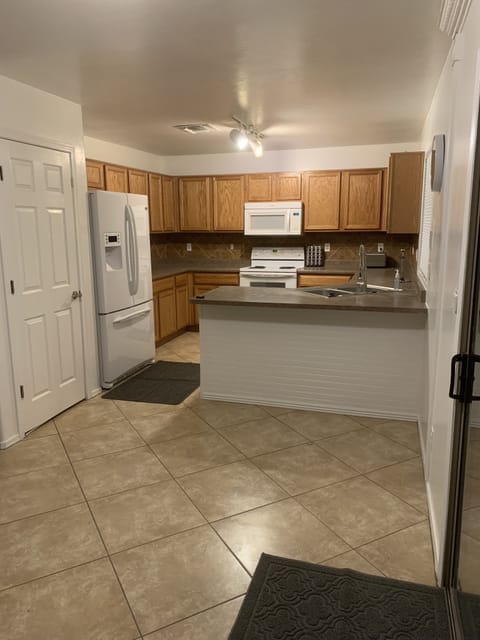 Kitchen with refrigerator, oven/stove, microwave, dishwasher, Kuerig coffeemaker