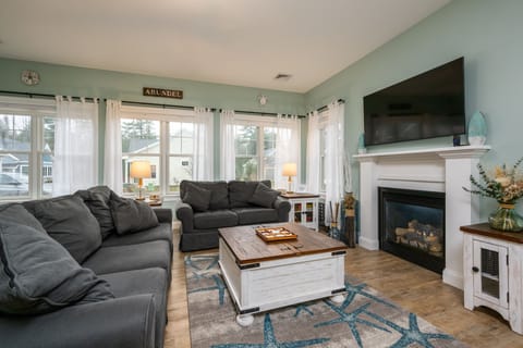 Open concept living room, comfortable pull out sofa.  Gas fireplace.