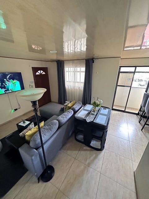 Deluxe Apartment, 2 Bedrooms, Air conditioning (Entire Two-Bedroom Apartment for 4) | Living area | 55-inch Smart TV with cable channels, TV