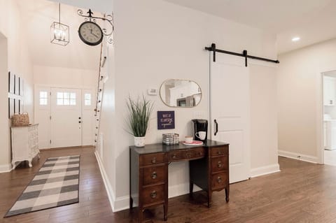 Coffee bar, pantry, and view into huge laundry room