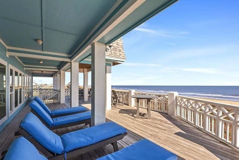 Patio view from the west showcasing endless coastline and relaxing lounge seating.