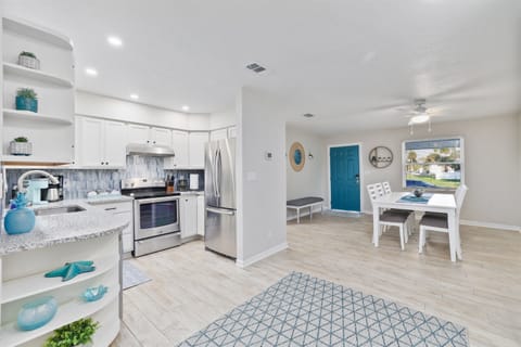 Spacious kitchen and dining area designed for gathering with family or friends