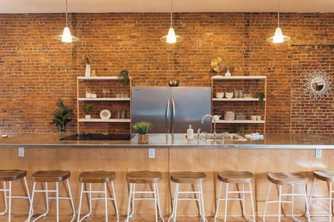 In the heart of this brick loft, culinary dreams take center stage in a sprawling industrial kitchen, where stainless steel gleams against the rugged charm of exposed brick. A perfect fusion of sophistication and raw elegance, inviting you to savor both the flavors and aesthetics of contemporary loft living. 🍴🏢 #UrbanCuisine #IndustrialChic
